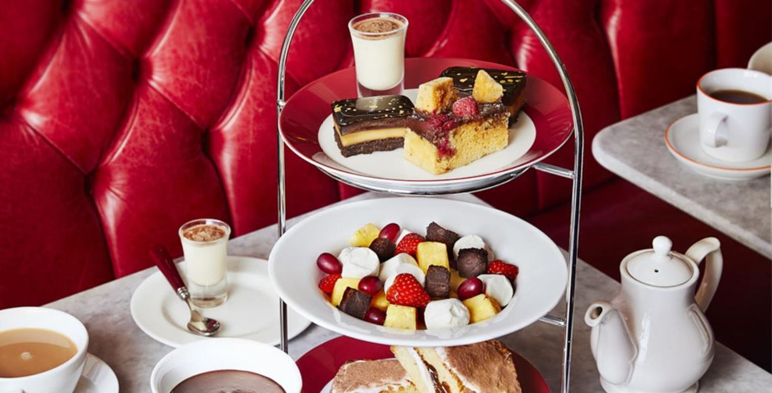 Afternoon Tea selection including cakes and sandwiches at Cafe Rouge
